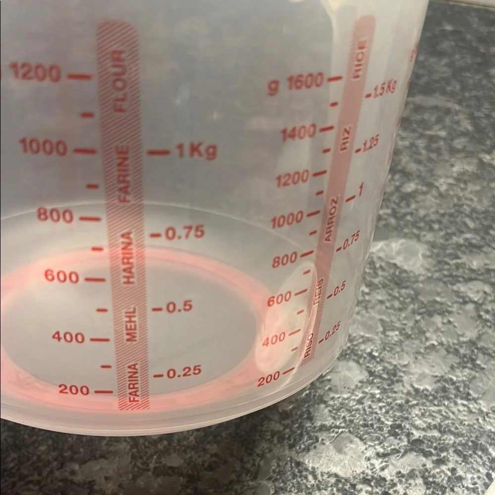Tupperware Mix n Store Red and White Measuring cup. New without tags